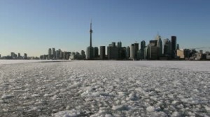 stock-footage-moving-wide-shot-of-the-toronto-skyline-with-lake-ontario-frozen-over-in-the-foreground