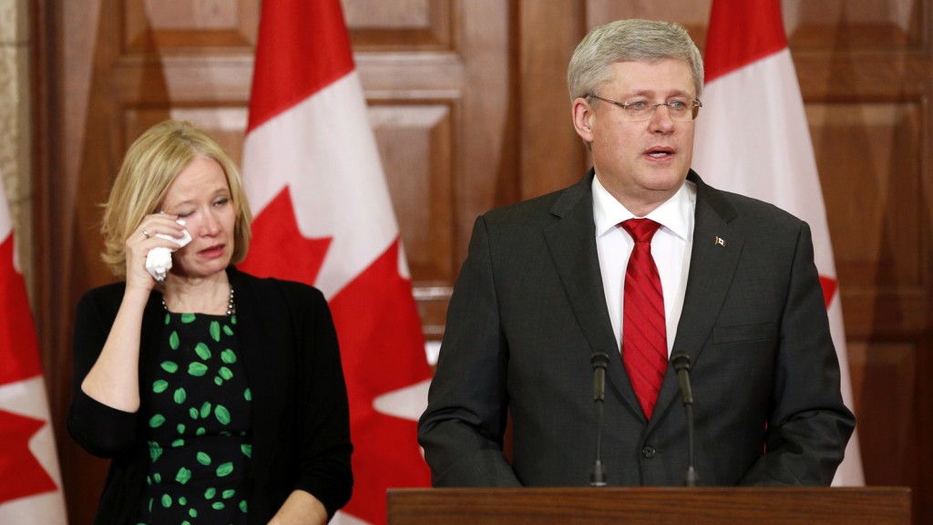 Canada's PM Harper and his wife Laureen take part in a news conference following the news of former Finance Minister Flaherty's death on Parliament Hill in Ottawa