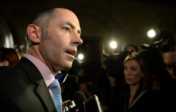 Prime Minister Stephen Harper's director of communications Jason MacDonald speaks to reporters in the foyer of the House of Commons on Parliament Hill in Ottawa on Wednesday, Nov. 20, 2013. THE CANADIAN PRESS/Sean Kilpatrick